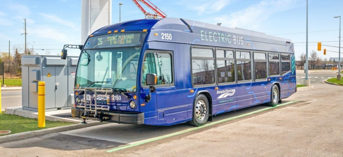 An electric bus being charged