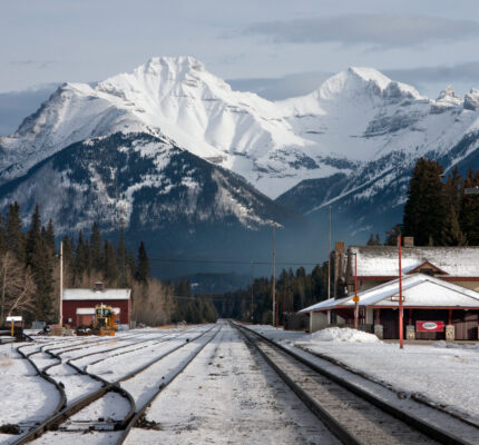Train tracks and a train station in the Rocky Mountains near Banff