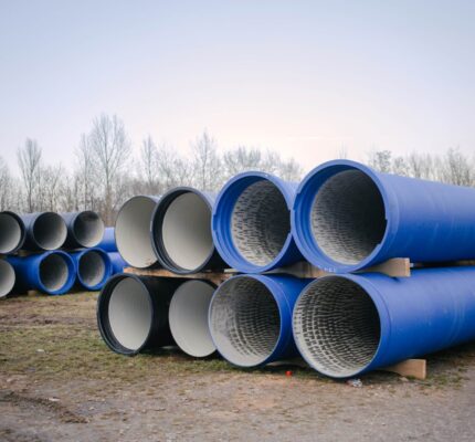 A stack of blue pipes used for water and wastewater transfer.