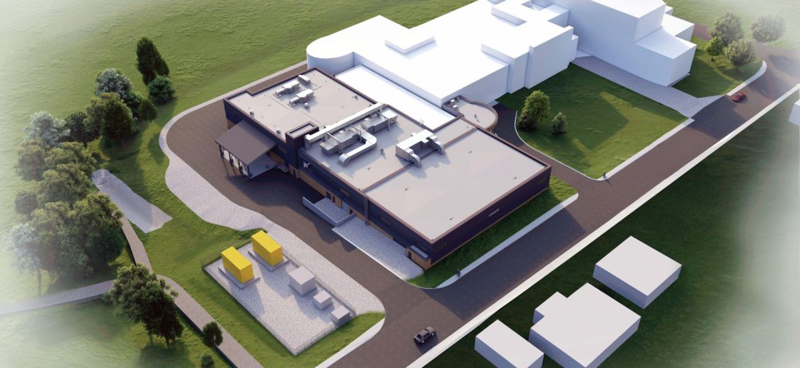 Architectural aerial view rendering of Brandon water project, a dark-faced, flat-roofed building adjacent to a larger, white block structure, surrounded by green landscaping and asphalt driveways.