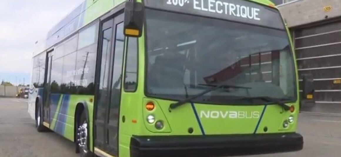 An electric city bus outside of an Ottawa transit garage