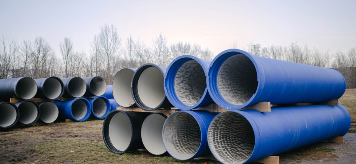 A stack of blue pipes used for water and wastewater transfer.