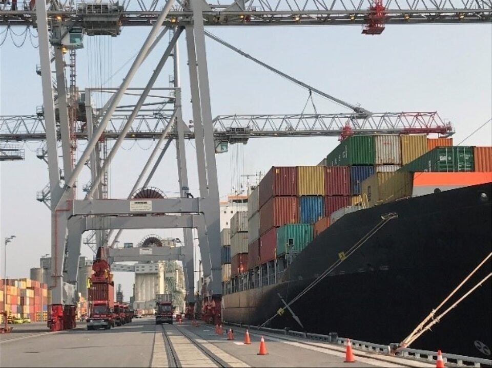 Cranes loading shipping containers onto a ship at the Contrecour Port in Montreal