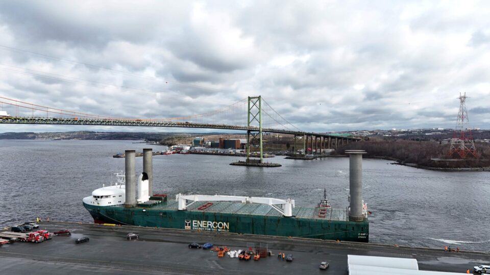A ship docking at the Halifax port with turbine parts being delivered.