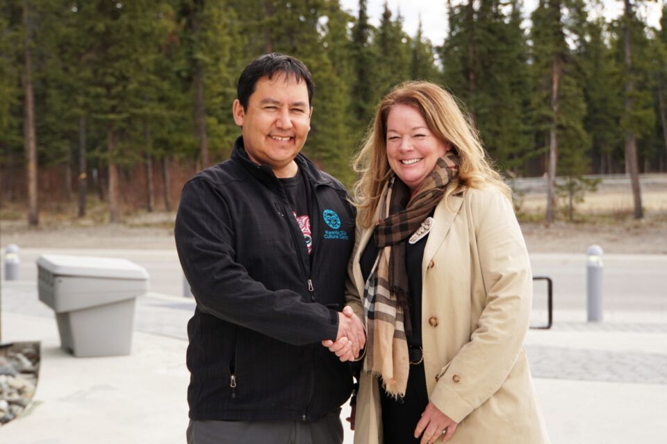 Photo of Chief Sean Smith of KDFN and Hillary Thatcher of the CIB shaking hands.