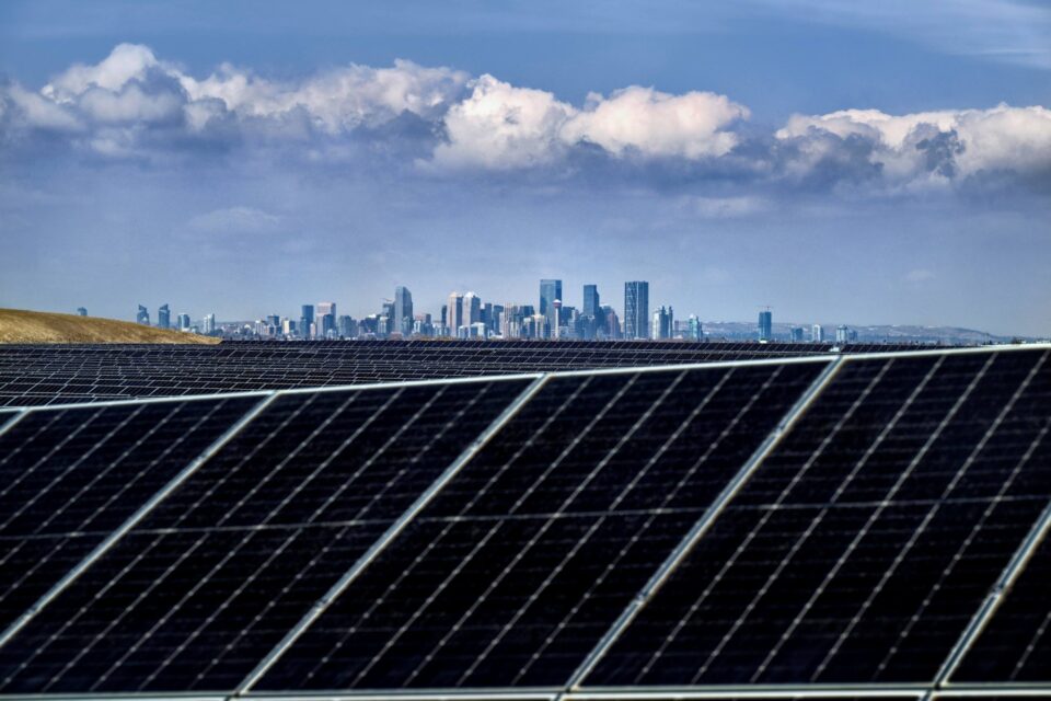 Solar panels with Calgary skyline in background