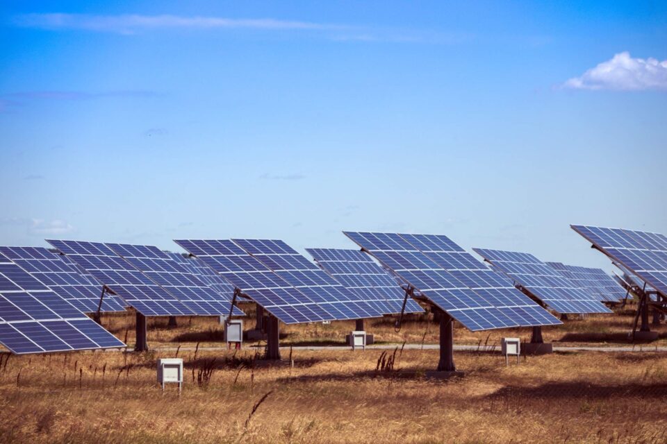 Large solar panel point to the blue sky on a field at a Canadian solar farm