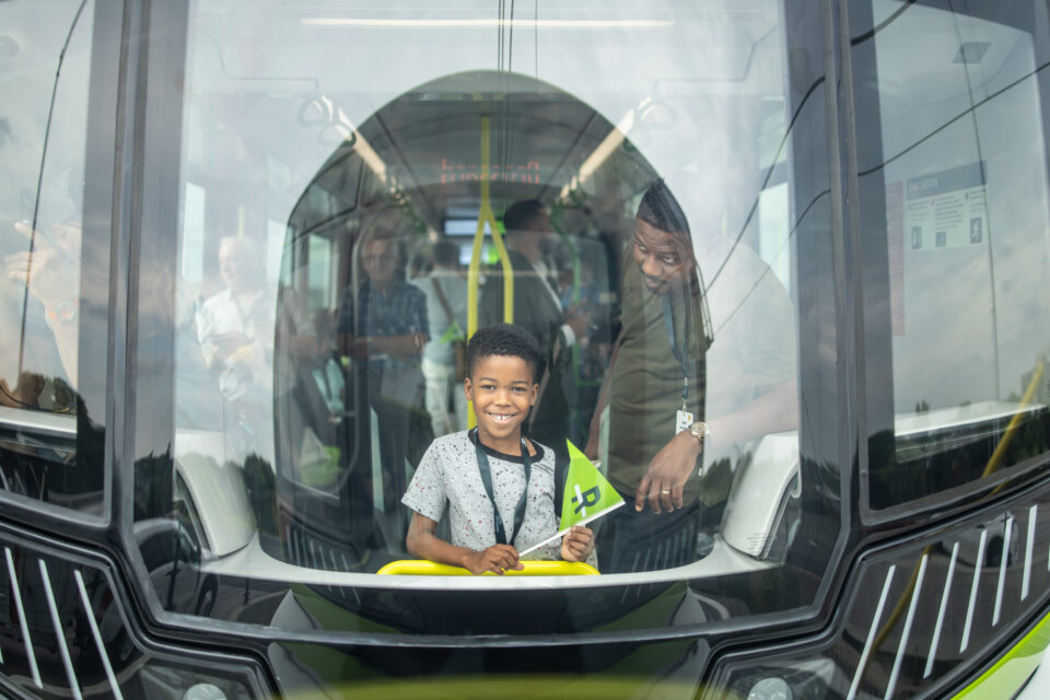 A Montreal child takes one of the first rides on the REM during opening weekend celebrations. (Courtesy of REM)